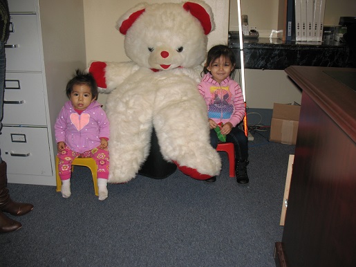 Two small children and the Christmas Teddy Bear